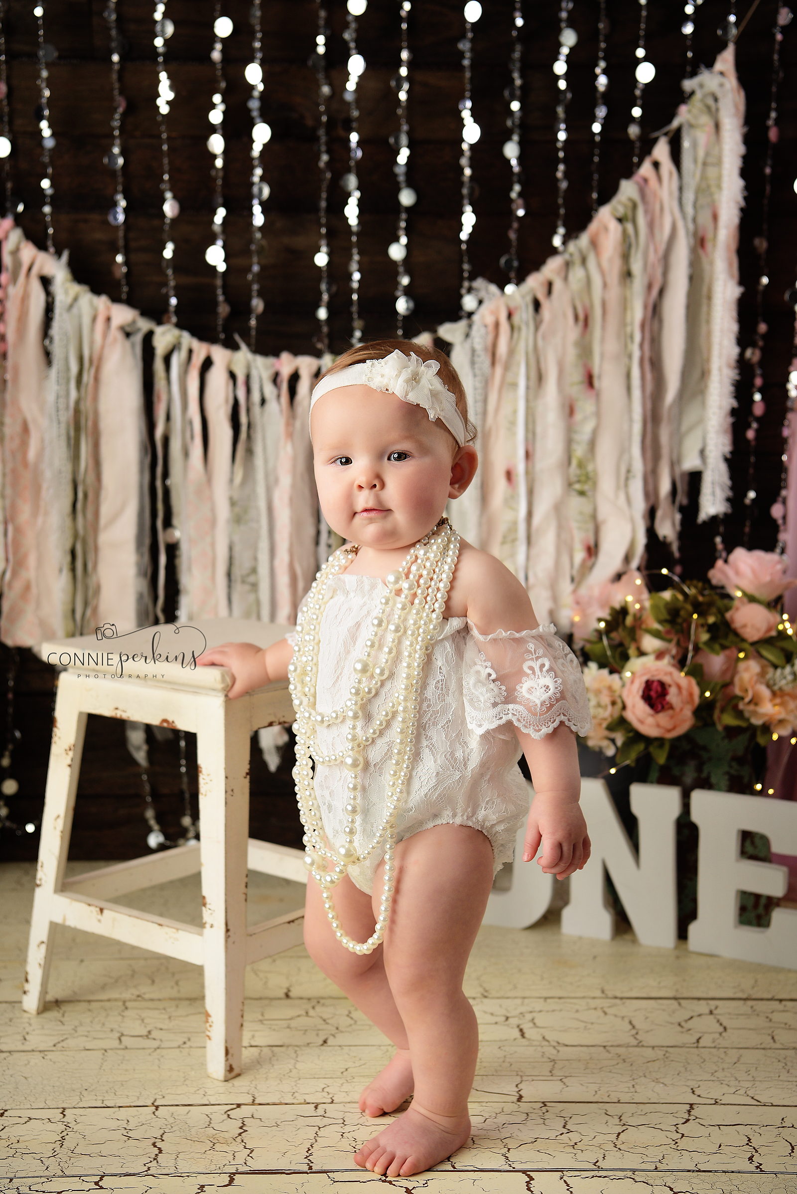 photo of one year old girl with pearls