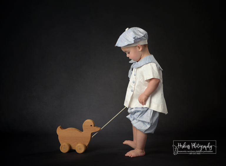 vintage photoshoot with 18 month boy and pull duck